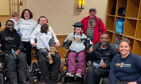 Participants at a nonprofit’s adaptive skiing event, sponsored by accessiBe.